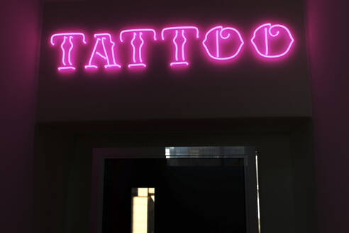 Illuminated tattoo text on door - NMCF00025