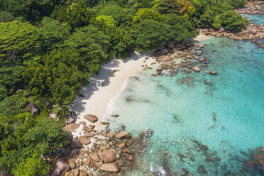 Seychelles, Praslin Island, Aerial view of Anse Lazio sandy beach with crystal clear turquoise ocean - RUEF03157