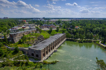 Sweden, Vastra Gotaland County, Uddevalla, Hydroelectric power station on Gota Alv river with town in background - LBF03356