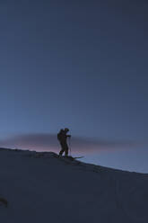 Mature man skiing during winter - JAQF00255