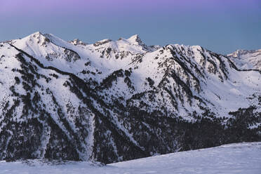 Pyrenees mountain covered in snow during sunrise - JAQF00261