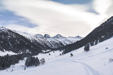 Beautiful snowy mountains against cloudy sky during sunrise - JAQF00295