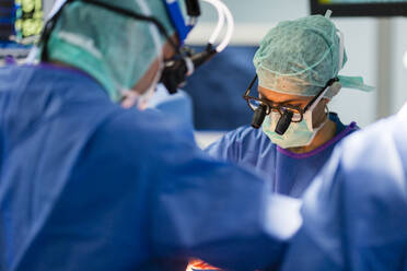 Two cardiovascular surgeons operate on a patient - CAVF92887