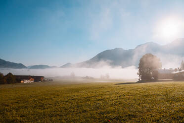 Sunrise over foggy valley in Berchtesgaden Alps - MRRF00890