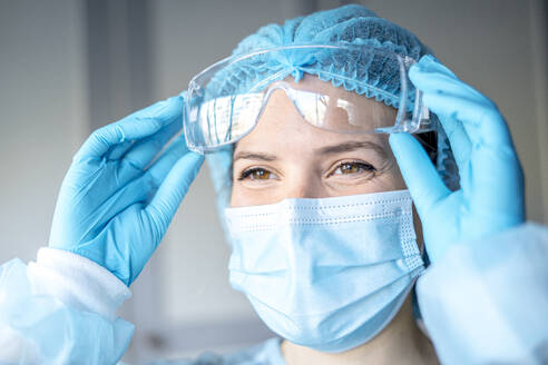 Happy Medical Surgical Doctor and Health Care, Portrait of Surgeon Doctor in PPE Equipment on Isolated Background. Medicine Female Doctors Wearing Face Mask and Cap for Patients Surgery Work. - CAVF93196