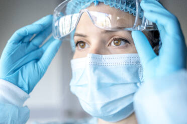 Medical Surgical Doctor and Health Care, Portrait of Surgeon Doctor in PPE Equipment on Isolated Background. Medicine Female Doctors Wearing Face Mask and Cap for Patients Surgery Work. Medic - CAVF93197