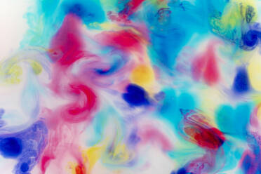 Full frame of colorful liquids mixing together - GEMF04657