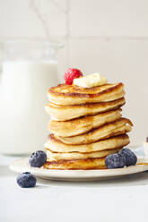 Fluffy breakfast pancakes with maple syrup and berries - ADSF20767