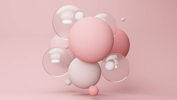 Three dimensional render of pastel colored bubbles floating against pink background - JPSF00034