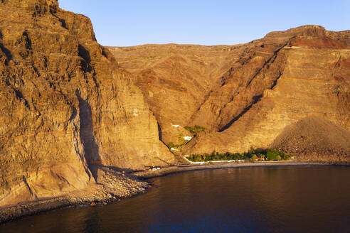 Spain, Valle Gran Rey, Drone view of Barranco de Argaga gorge and Playa de Argaga beach at dusk - SIEF10103