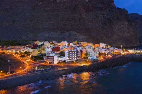 Spain, Valle Gran Rey, Drone view of town at edge of La Gomera island at dusk - SIEF10108