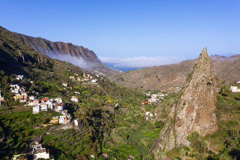 Spain, Hermigua, Drone view of Roques de San Pedro and small town in Garajonay National Park - SIEF10113