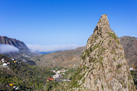 Spain, Hermigua, Drone view of Roques de San Pedro and small town in Garajonay National Park stock photo