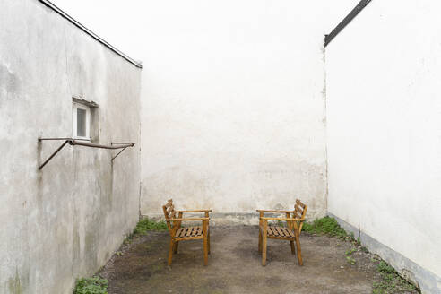 Empty chairs in yard - DRF01761