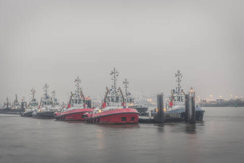 Tug boats in fog stock photo