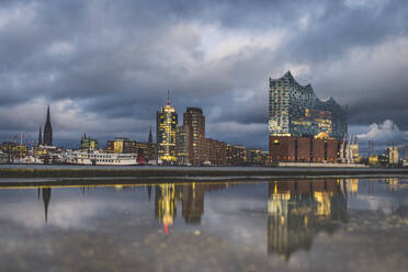 Germany, Hamburg, Anleger theatre and Elbe Philharmonic Hall reflecting in water - KEBF01813