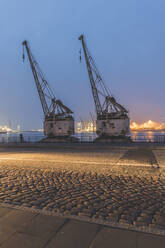 Germany, Hamburg, Altona, Cranes at harbor - KEBF01820