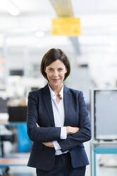 Mature businesswoman with arms crossed at office - JOSEF03700