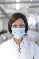 Female technician in laboratory during COVID-19 - JOSEF03868