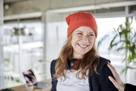 Smiling woman with hand of woman on shoulder at home stock photo