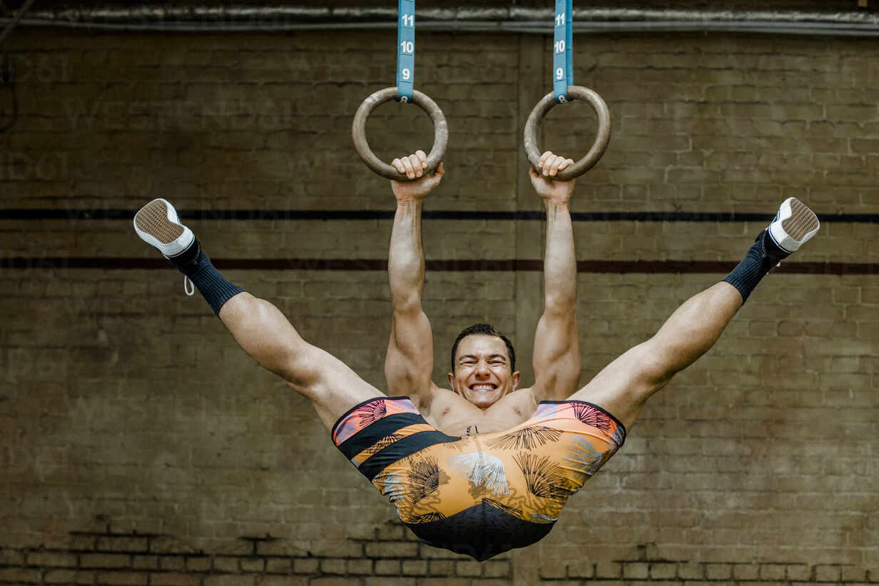Rings workout man gym hanging hi-res stock photography and images - Alamy