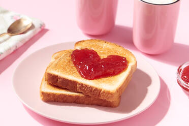 Toast with Heart Shaped Jam and Coffee on Pink - CAVF93566