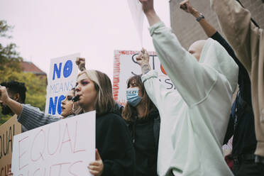 Female activist with equal rights protesting during COVID-19 - MASF22178