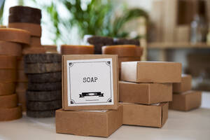 Arrangement of handmade soap boxes at workshop - VEGF04038