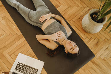 Tired Plus Size Black Woman Lying on Yoga Mat Near Laptop, Wiping Forehead  after Strength Training at Home Stock Image - Image of coronavirus,  fatigue: 245360505