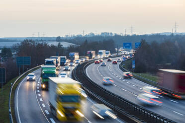 Germany, Baden-Wurttemberg, Sindelfingen, Traffic on A 81 at dusk - WDF06540