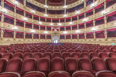 Interior of the Teatro Verdi, red velvet seats in the auditorium, Trieste, Italy. - MINF16032