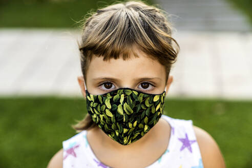 Girl with bangs wearing protective face mask outdoors - AMPF00104