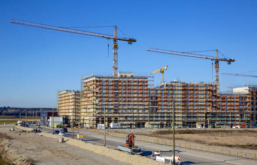 Germany, Bavaria, Munich, Large construction site with cranes - MAMF01666