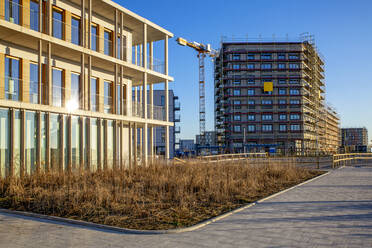 Germany, Bavaria, Munich, Large construction site with crane - MAMF01675