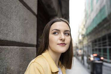 Beautiful woman with brown hair looking away - JCCMF01424