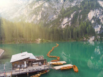 Log cabin on Pragser Wildsee lake by Croda del Becco mountain at Dolomites, Alto Adige, Italy - LOMF01249