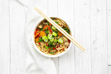 Asian noodle soup with rice noodles, bell pepper, mushrooms, spring onions, coriander and carrots - LVF09112