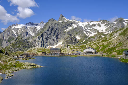 Italy, Aosta Valley, Pain du Sucre towering over Great Saint Bernard Lake - LBF03485