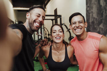 Happy sports people taking selfie at health club - EBBF02877