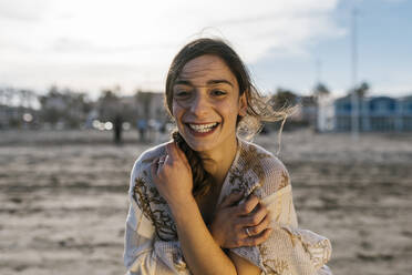 Cheerful young woman at beach - EGAF02207