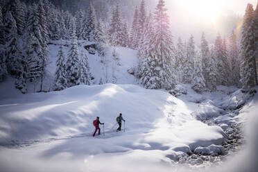 Couple ski touring together during winter - MALF00348