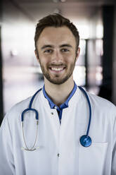 Confident male doctor with stethoscope at hospital - BMOF00533