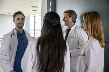 Male and female medical team discussing at hospital - BMOF00539