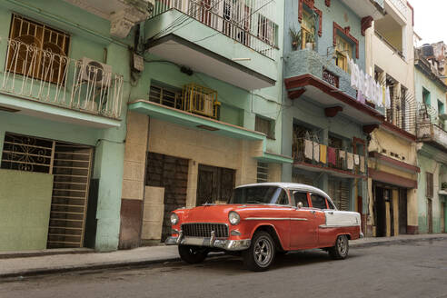 Orange and white vintage car in old town - RNF01318