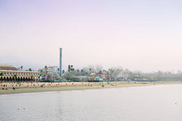 USA, California, Santa Cruz, Amusement park on sandy beach seen from Municipal Wharf - BRF01509