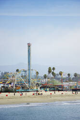 USA, California, Santa Cruz, Amusement park on sandy beach seen from Municipal Wharf - BRF01512