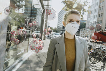 Woman with protective face mask amidst COVID-19 virus in city - LIFIF00015