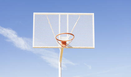 Basketball hoop over on sports court - JCCMF01726