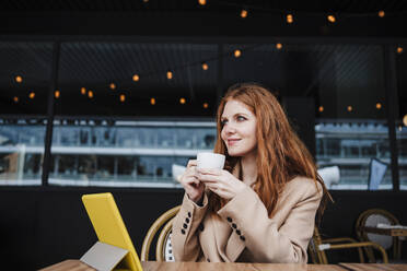 Beautiful woman having coffee at cafe - EBBF03131