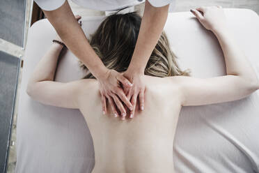 https://us.images.westend61.de/0001544441j/female-physiotherapist-giving-massage-to-patient-in-clinic-EBBF03237.jpg